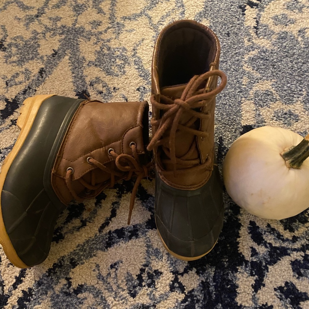 Boys Sperry duck boots.
